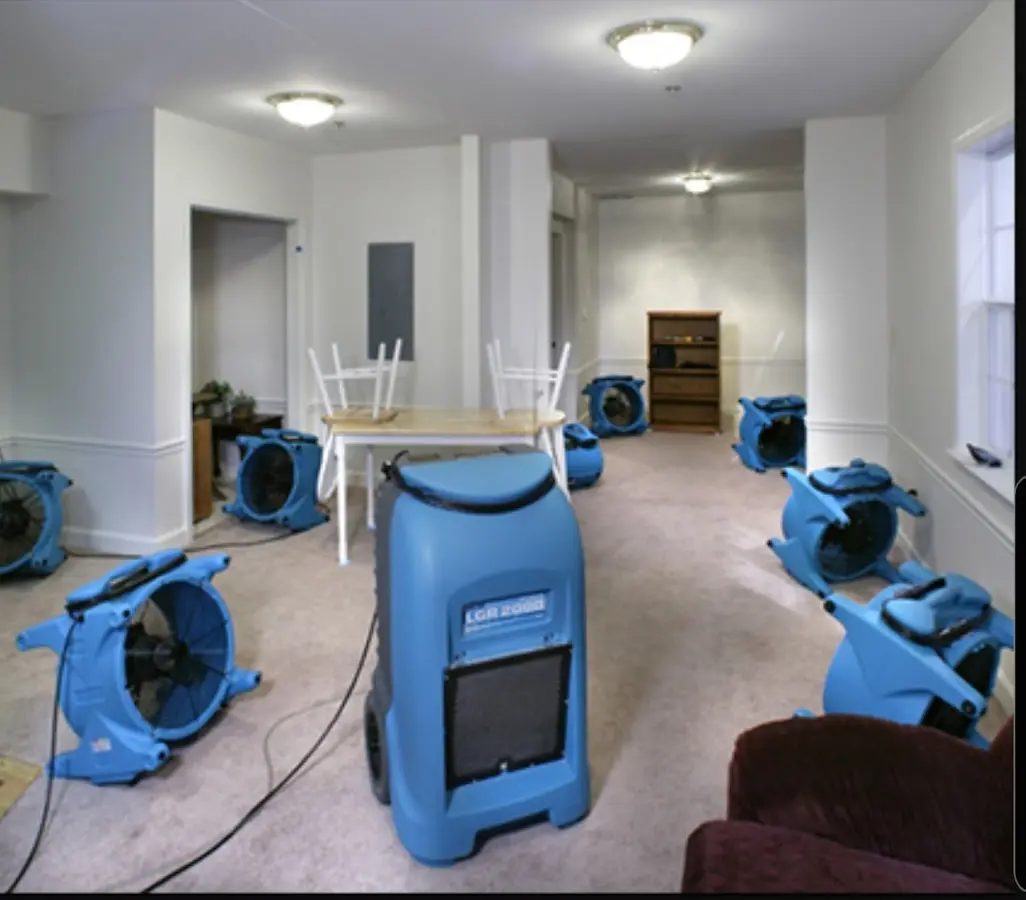 Air movers and dehumidifier setup for Water Damage Restoration in Eastham
